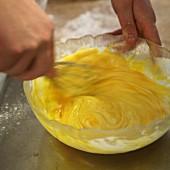 Egg yolk being beaten with a whisk