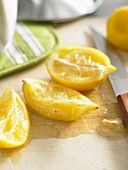 Boiled lemons on a wooden cutting board