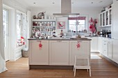 Festively decorated white country-house kitchen