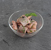 Herring fillet with dill in a glass bowl