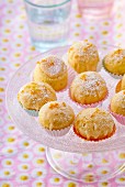 Steamed orange cakes with glaze and icing sugar