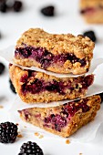 A stack of three slices of blackberry crumble