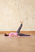 Leg raises (yoga), on the mat