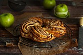 Apple and cinnamon wreath on a wire rack