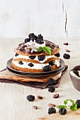 A layered blackberry and chocolate cake