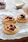 Puff pastry tartlets with a berries and a vanilla and quark filling