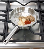 Roasting spices in a pan