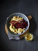 Roasted beetroot and parsnip spirals with hummus