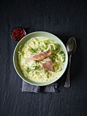 Kohlrabi spiral soup with smoked trout