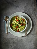 Courgette tagliatelle with a lime and avocado salsa and tomatoes