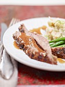 Leg of lamb with beans and mashed potatoes