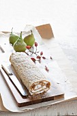 An autumnal Swiss roll with pears and cream