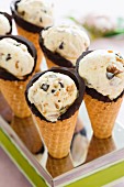 Butterscotch and chocolate ice cream in cones