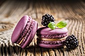Blackberry macaroons on a wooden table