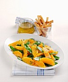 Orange and mange tout salad with breadsticks