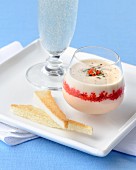 Spicy mousse with red caviar served with Prosecco