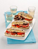 Olive rolls with tomatoes and anchovies