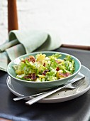 A rustic chicory salad with bacon