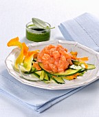 Salmon tartare on a courgette medley with a herb sauce