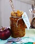 Homemade apple chutney in a glass jar as a gift