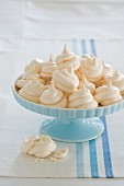 Meringues on a light blue cake stand