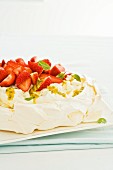 Pavlova with cream, strawberries and passion fruit