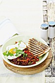 Huevos Rancheros – fried egg with a pepper and bean medley and grilled bread