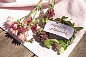 Welcome sign on small wreath of marjoram