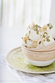 Frozen yoghurt with mint pesto and macadamia nuts