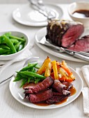 Roast beef with a side of vegetables