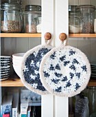 Homemade crocheted pot holders made from felting wool