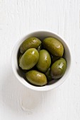 Bella di Cerignola olives in a white bowl