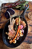 Pork chops and vegetables in a frying pan