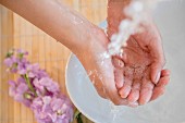 A woman washing her hands