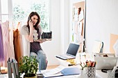 A woman on the phone in an office