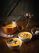 Pumpkin soup with smoked peppers, pumpkin seeds and Sriracha cream