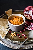 Muhamarra (Lebanese dip) with pomegranate, walnuts and unleavened bread
