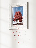 Leaves falling from tree in picture frame - 3D rendering