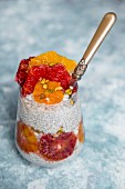 Chia pudding with sliced oranges and grapefruit in a glass