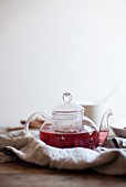 Fruit tea in a glass teapot