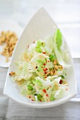 Cauliflower salad with spring onions and pine nuts
