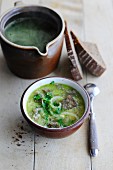 Rustic bread soup with herbs and onions
