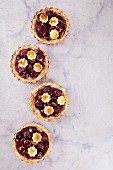 Mini shortcrust pies with cherries (seen from above)