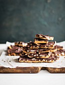 Chocolate slices with caramel and pieces of pretzel