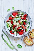 Strawberry and asparagus salad with feta cheese and pine nuts