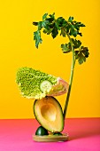 A vegetable sculpture against a coloured background