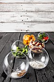 Ingredients for gluten-free veggie burgers in glass bowls