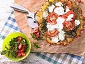 A gratinated potato fritter with tomato and mozzarella