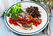 Hake fillets with a pepper salsa and wild rice