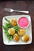 Courgette and feta cheese fritters with beetroot yoghurt
